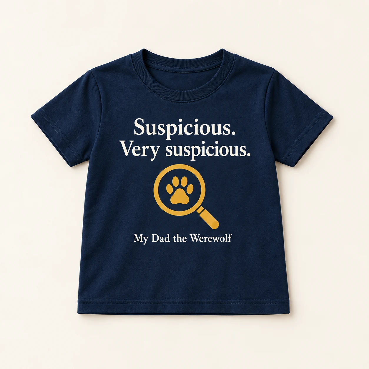 Concept mockup of a navy child shirt with Suspicious... VERY suspicious. lettering and a gold magnifying paw.